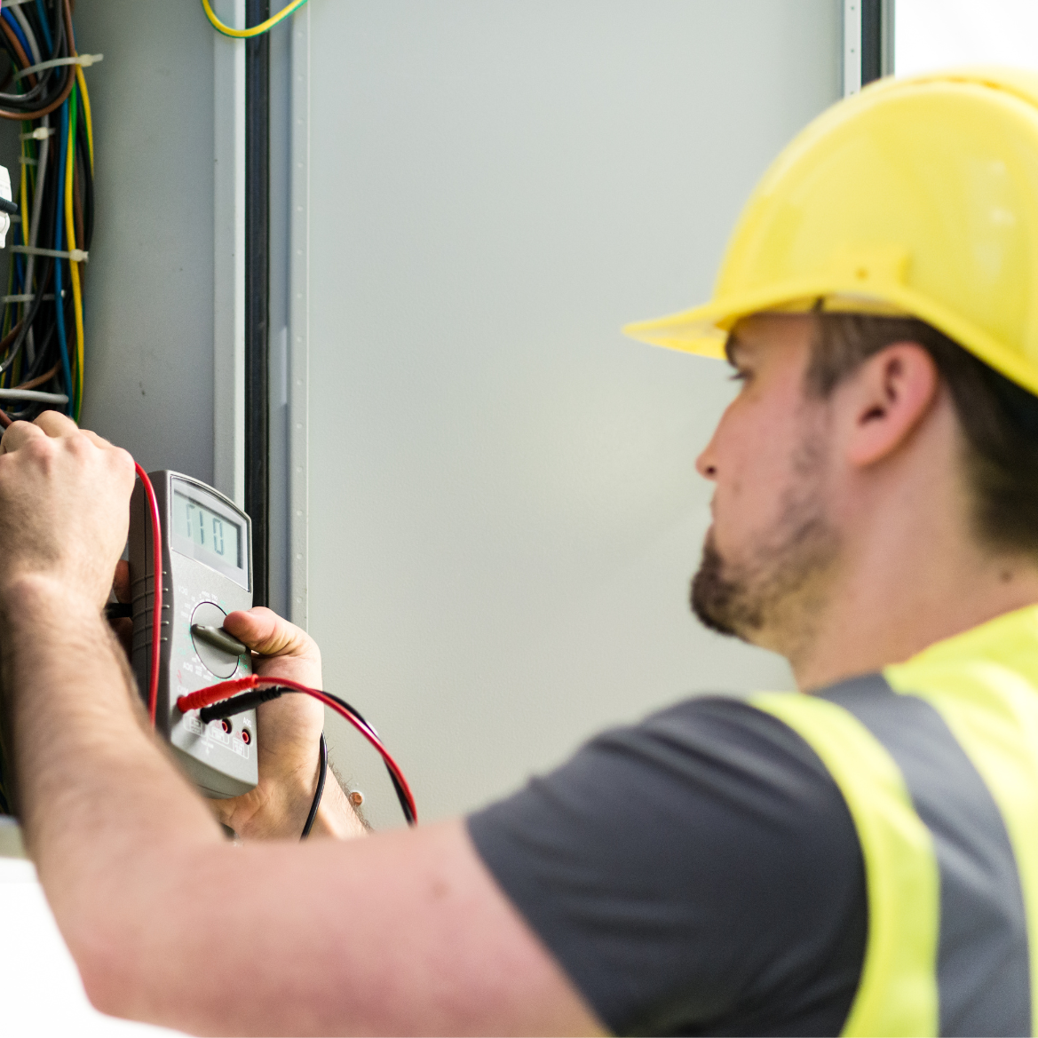 Electrician Working on Electrical Panel